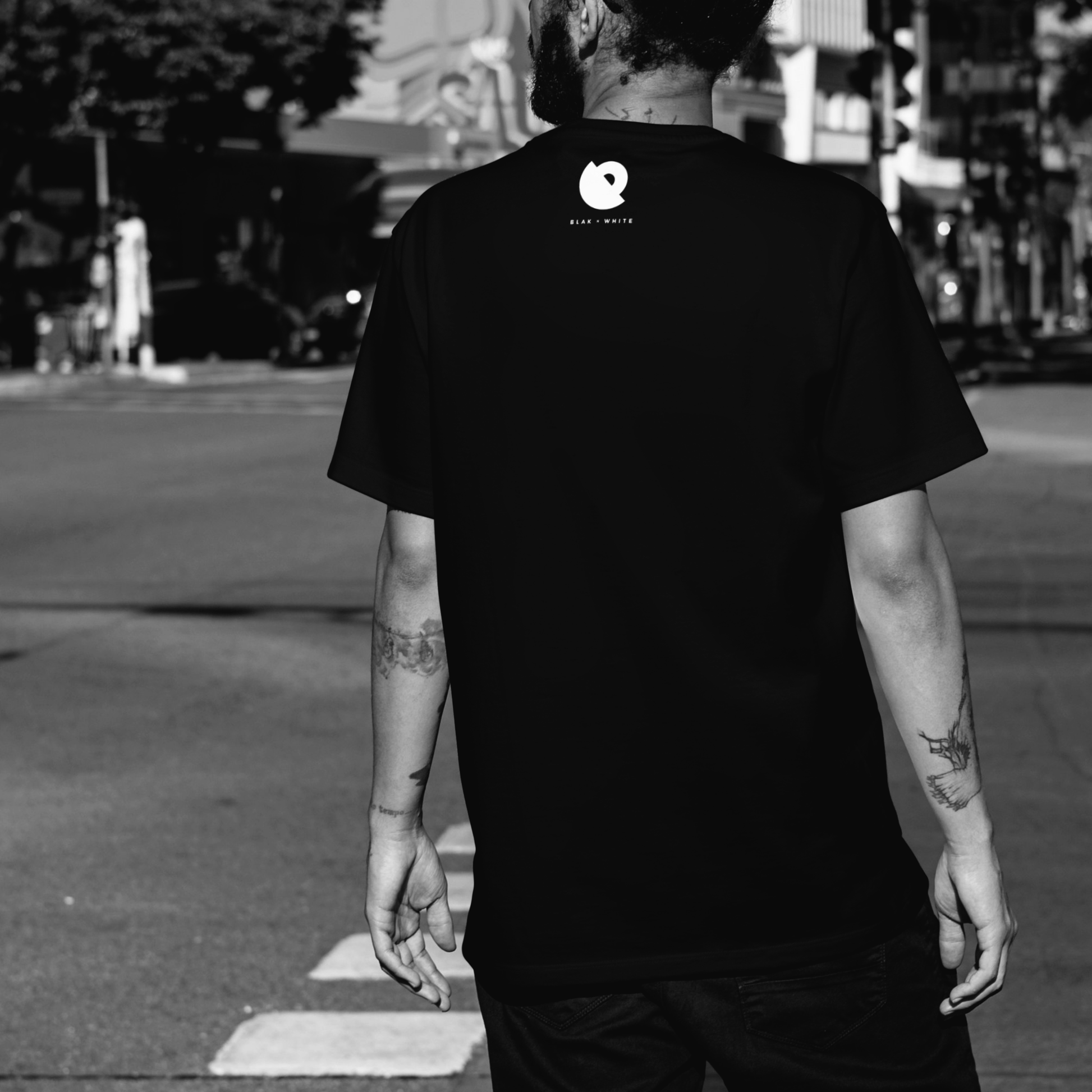 Back design of Don’t Bottle black oversized t-shirt featuring minimalist motivational artwork — Blaknwhite.