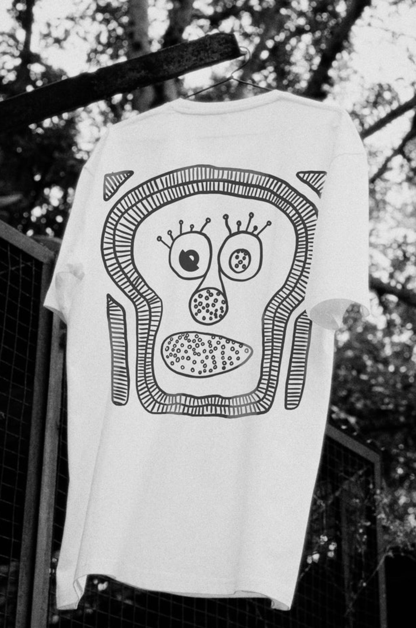 Back view of The ‘Monk’-I Man white oversized unisex t-shirt by Blaknwhite — minimal front streetwear design.