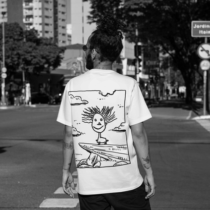 Close-up of The Simba-al of Hope print artwork on white cotton t-shirt – symbol of hope design detail.