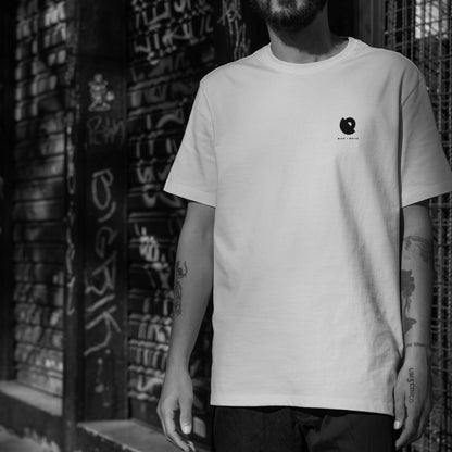 Model wearing The Simba-al of Hope white graphic t-shirt – art-inspired streetwear by Blaknwhite.