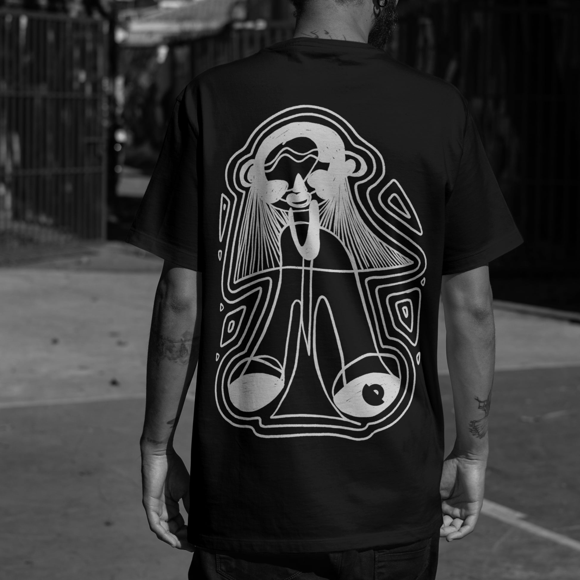 Back print of The RockStar black oversized unisex tee — Blaknwhite