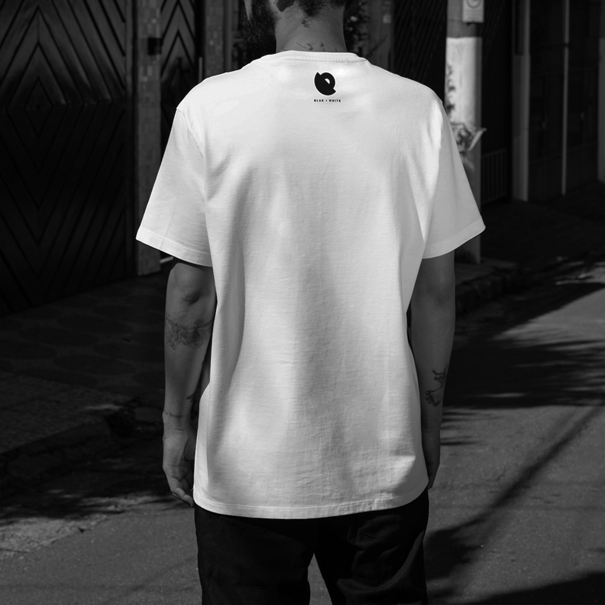 Back print of Don’t Bottle white oversized t-shirt featuring motivational artwork — Blaknwhite fashion.