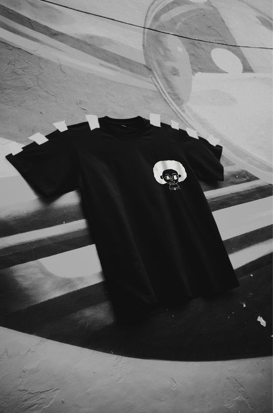 Front view of The Artist black oversized unisex t-shirt by Blaknwhite – cotton streetwear for creatives.