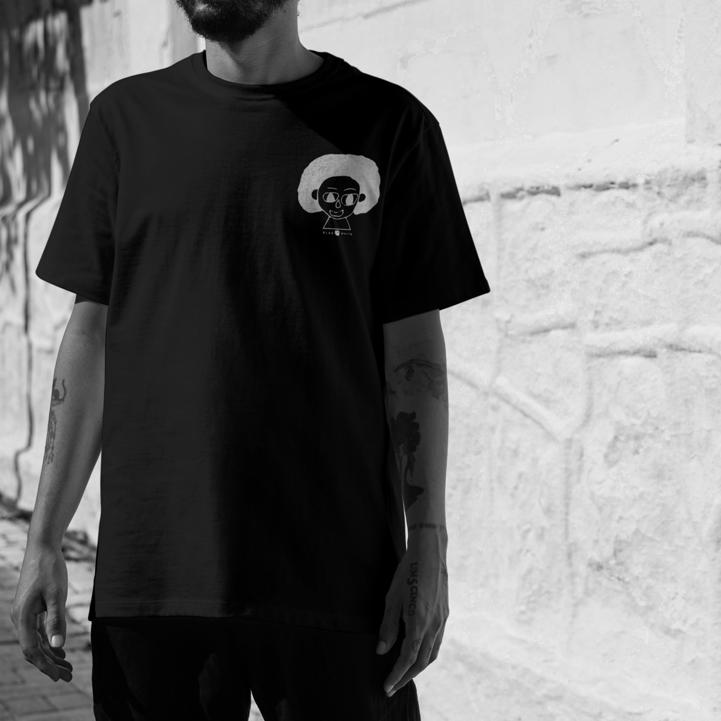 Detail of The Artist black cotton t-shirt print – abstract art-inspired design for unisex wear.