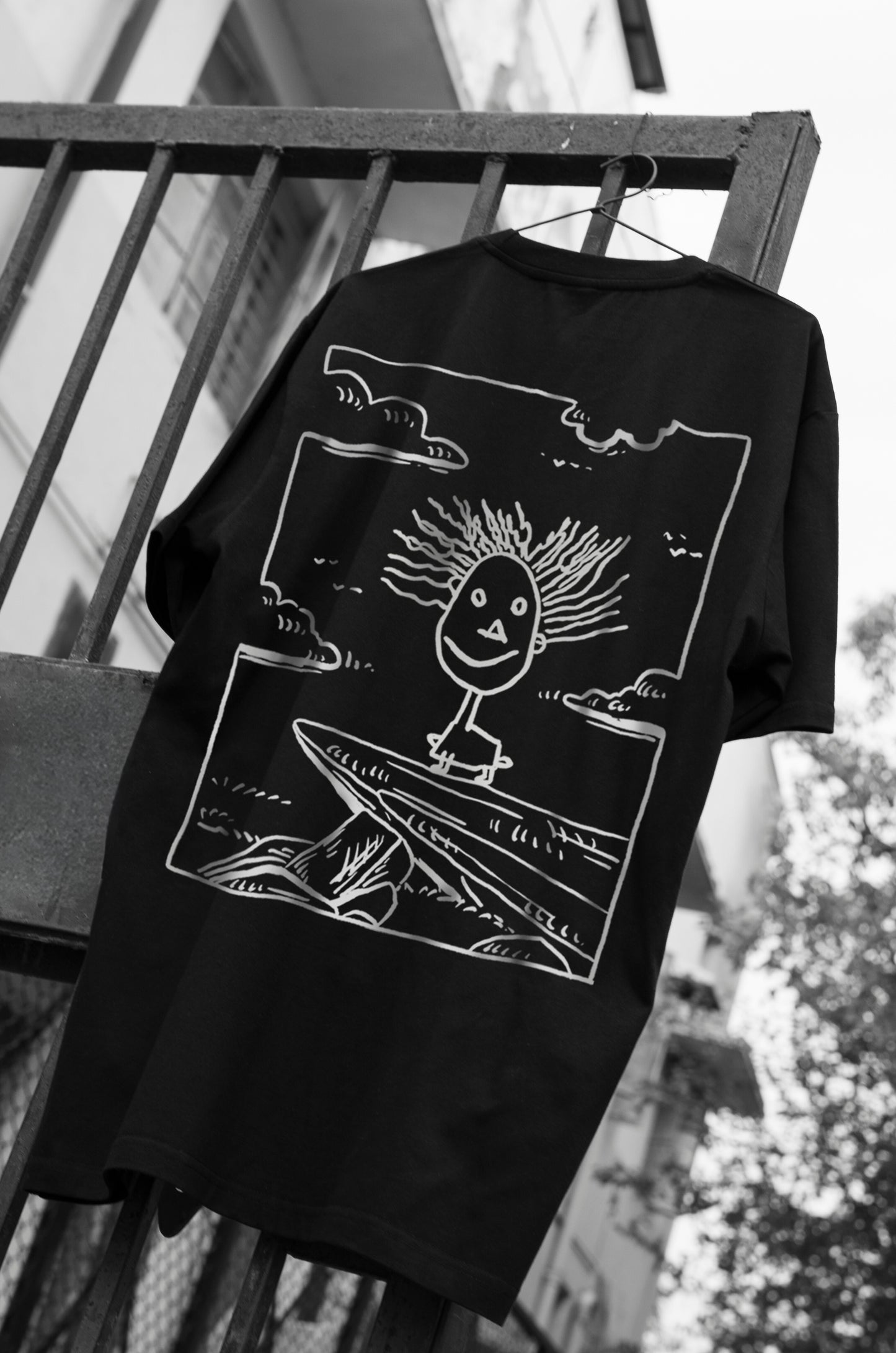 Oversized black T-shirt with a round neck and short sleeves, featuring a graphic print of Simba from Disney's 'The Lion King' on the front.