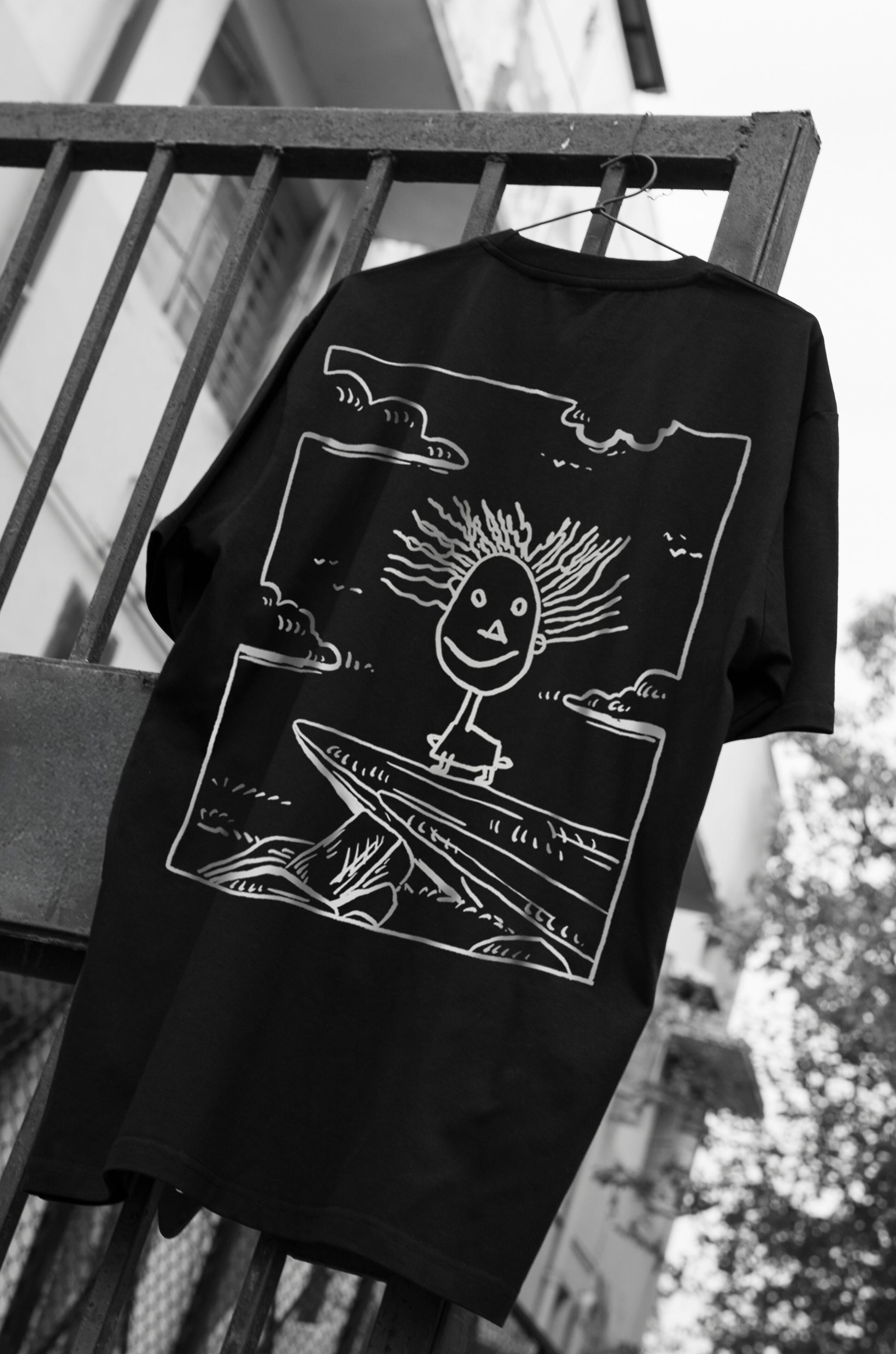 Oversized black T-shirt with a round neck and short sleeves, featuring a graphic print of Simba from Disney's 'The Lion King' on the front.