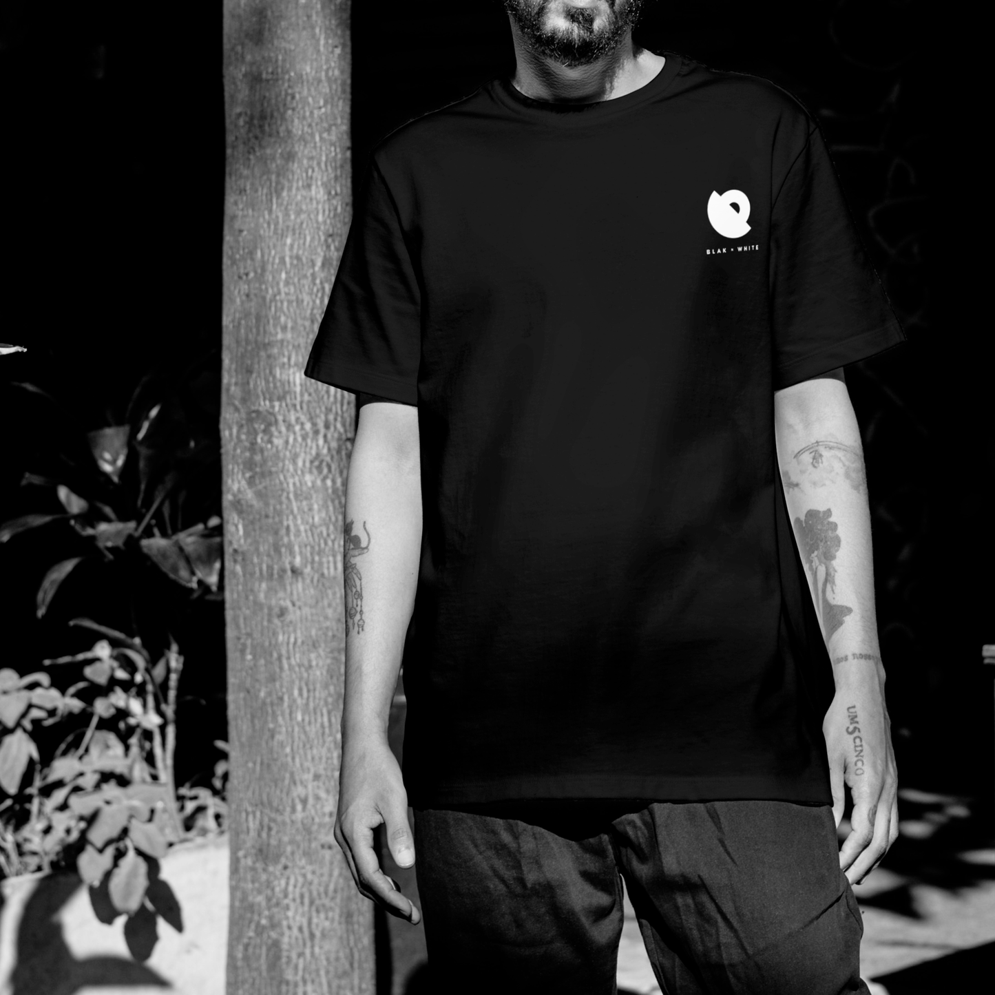 Model wearing The Wondering Soul black oversized graphic t-shirt — unisex cotton streetwear by Blaknwhite.