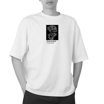 Art-inspired front design on The Ogler White oversized unisex tee by Blaknwhite