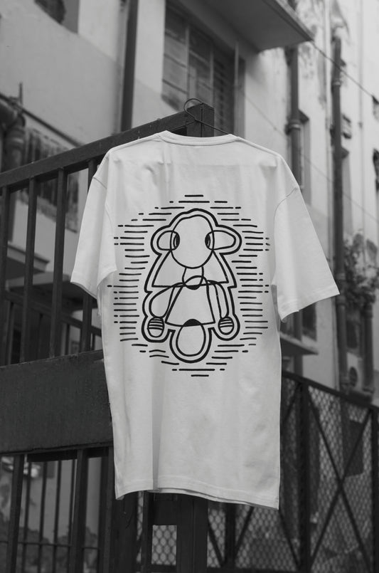 Oversized white t-shirt with a round neck and short sleeves, featuring a black and white line art design of a figure on the front.