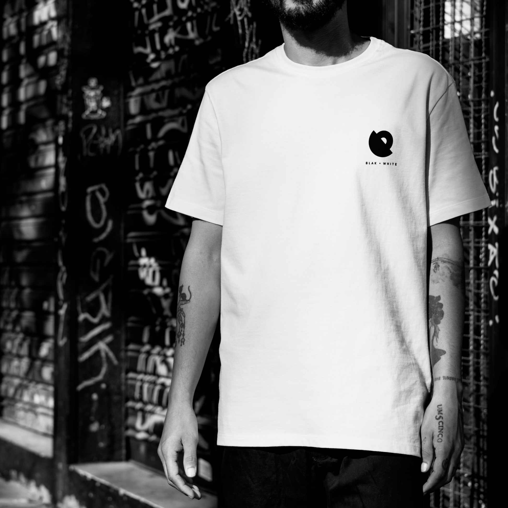 Model wearing The Wondering Soul white oversized graphic t-shirt — unisex cotton tee by Blaknwhite.